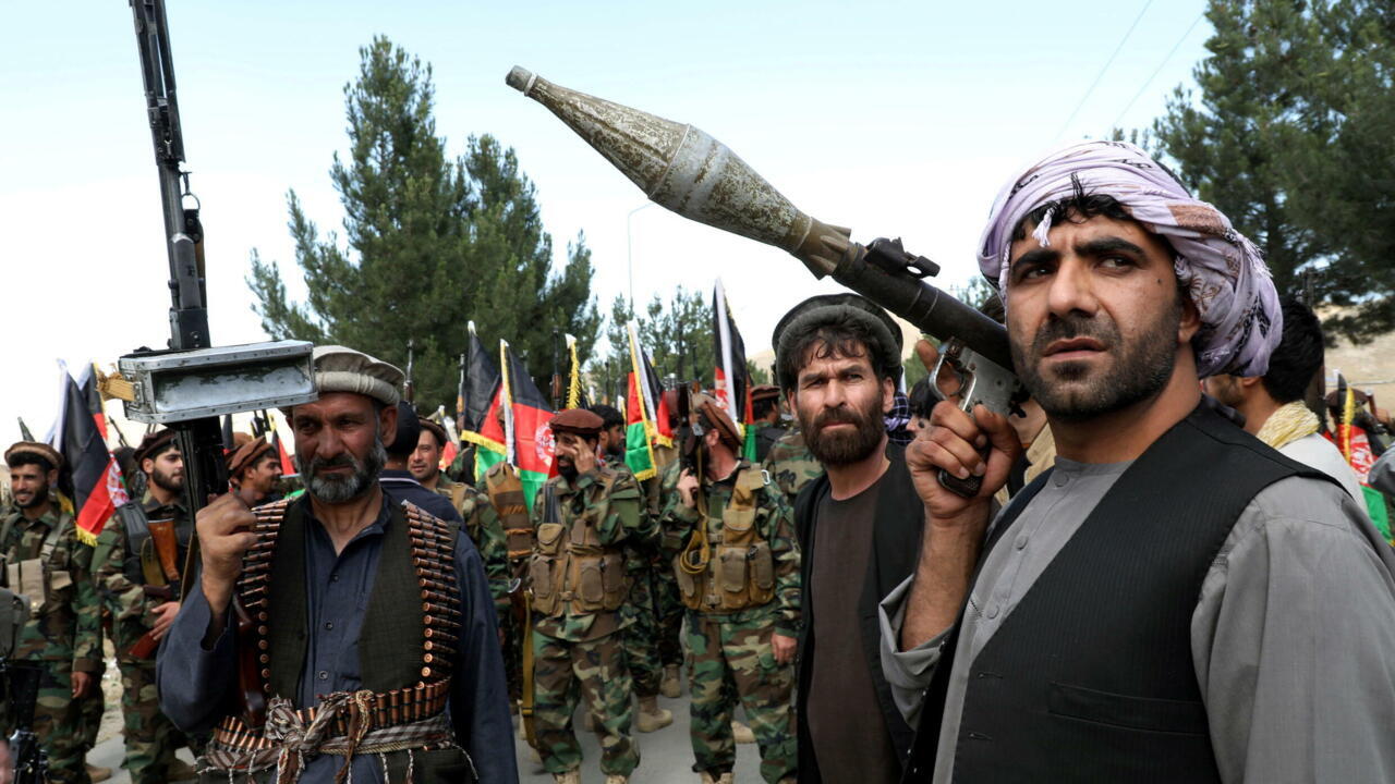 Hundreds of armed men gather to announce their support for Afghan security forces on the outskirts of Kabul